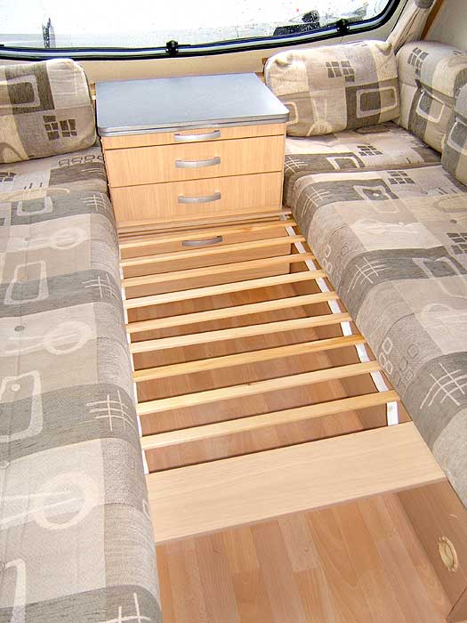 This array of wooden slats is called the Easy Bed Make Up System. It just makes preparing the area for sleeping a little bit easier.